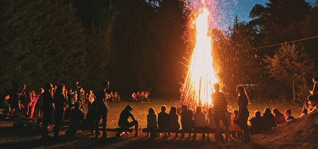 People standing around a bonfire