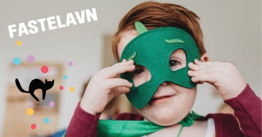 a child wearing a masquerade mask.
